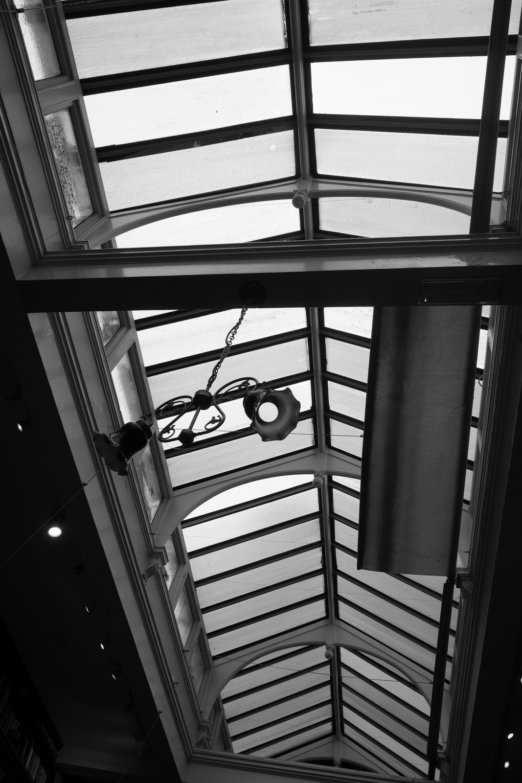 Black frames divide the translucent panels of an arcade roof.