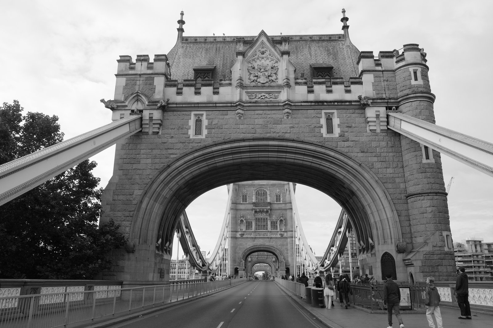 Tower Bridge arches over a nearly empty road.